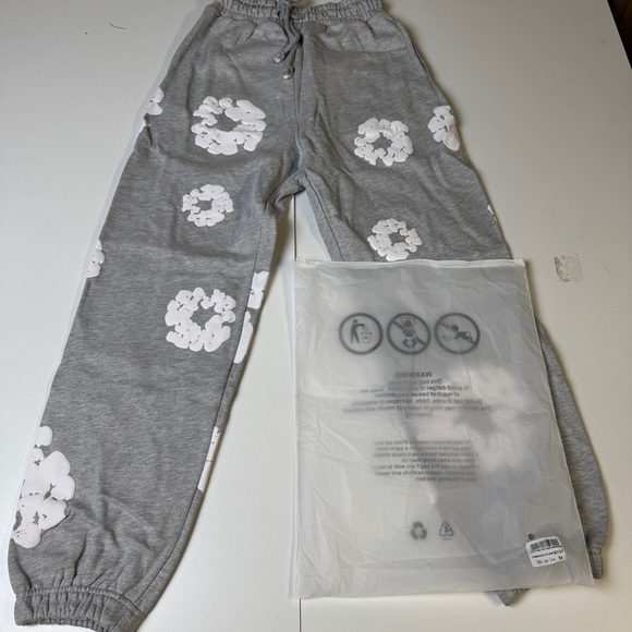 Denim Tears Other - Denim Tears Pants with White Floral Design